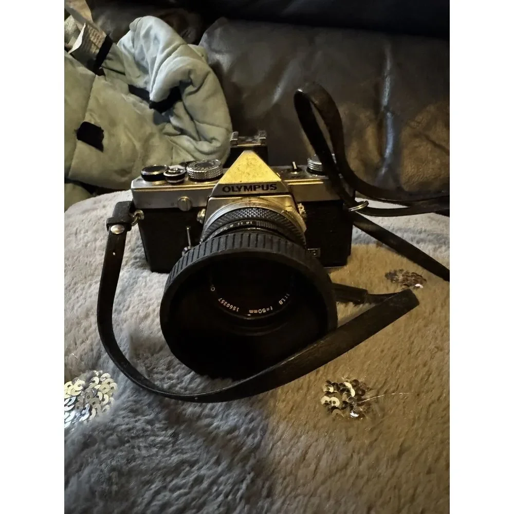 Olympus OM-1n Camera in Chrome With 50mm 1:1.8 Auto S Lens